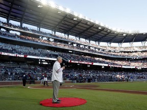 Former Atlanta Braves manager and Baseball Hall of Fame member Bobby Cox gives the command to "play ball" before the Braves' home opener baseball game against the Chicago Cubs, Monday, April 1, 2019, in Atlanta.