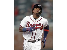 Atlanta Braves' Ronald Acuna Jr. rounds the bases after hitting a solo home run in the third inning of a baseball game against the Chicago Cubs, Monday, April 1, 2019, in Atlanta.