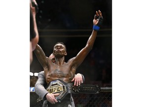 Israel Adesanya celebrates after defeating Kelvin Gastelum during an interim middleweight title mixed martial arts bout at UFC 236 in Atlanta on Saturday, April 13, 2019.