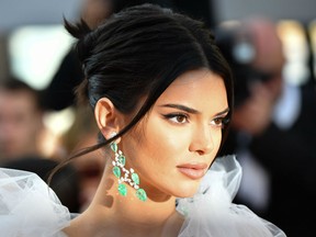 U.S. model Kendall Jenner poses as she arrives on May 12, 2018 for the screening of the film 'Girls of the Sun (Les Filles du Soleil)' at the 71st edition of the Cannes Film Festival in Cannes, FRANCE.