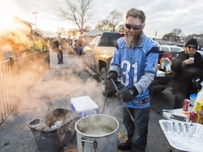 Brad Adams deep frying chicken wings at the Grey Cup tailgate party at the parking lot of Ontario Place across the road from BMO Field in Toronto, Ont.  on Sunday November 27, 2016.