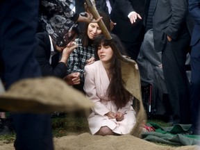 Hannah Kaye, daughter of shooting victim Lori Gilbert Kaye, mourns at her mother's grave during a graveside service on April 29, 2019, in San Diego, Calif. Kaye was killed inside the Chabad of Poway synagogue on April 27 by a gunman who opened fire as worshippers attended services.