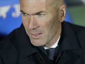 Real Madrid's coach Zinedine Zidane stands on the touchline before a Spanish La Liga soccer match between Getafe and Real Madrid at the Alfonso Perez stadium in Getafe, Spain, Thursday, April 25, 2019.