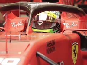 Mick Schumacher prepares for his first F1 test for Ferrari at the Bahrain International Circuit in Sakhir, Bahrain, Tuesday, April 2, 2019. Mick Schumacher has moved closer to emulating his father Michael by driving a Ferrari Formula One car in an official test. Schumacher's father won seven F1 titles, five of those with Ferrari and holds the record for race wins with 91.