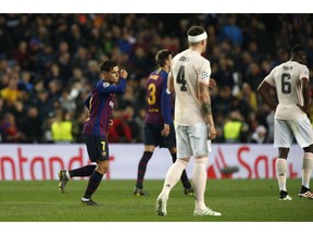 Barcelona forward Philippe Coutinho, left, celebrates after scoring his side's third goal during the Champions League quarterfinal, second leg, soccer match between FC Barcelona and Manchester United at the Camp Nou stadium in Barcelona, Spain, Tuesday, April 16, 2019.