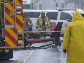A portion of the tail section of a helicopter is shown after crashing in Kailua, Hawaii, Monday, April 29, 2019. Fire and helicopter parts rained from the sky Monday in a suburban Honolulu community in a crash that killed three people aboard, officials and witnesses said.