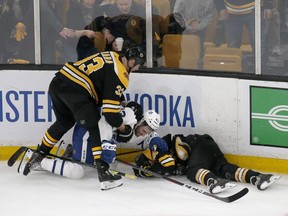 Boston Bruins defenseman Zdeno Chara (33) pulls Toronto Maple Leafs center Nazem Kadri (43) off teammate Jake DeBrusk (74) after Kadri hit DeBrusk into the boards during the third period of Game 2 of an NHL hockey first-round playoff series, Saturday, April 13, 2019, in Boston. he Toronto Maple Leafs will have to do without Nazem Kadri for the rest of their first-round playoff series with the Boston Bruins.