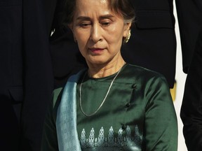 Myanmar's State Counselor Aung San Suu Kyi exits a plane upon her arrival at Phnom Penh International Airport, in Phnom Penh, Cambodia, Monday, April 29, 2019. Suu Kyi is in Cambodia on a three-day official state visit to Cambodia.