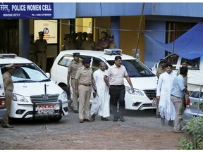 FILE - In this Sept. 19, 2018 file photo, bishop of the Indian city of Jalandhar, Franco Mulakkal, center, leaves after being questioned by police in Kochi, India. Indian authorities charged the Roman Catholic bishop on Tuesday with repeatedly raping a nun in her rural convent, a case that helped make the sexual abuse of nuns a major issue in the church.