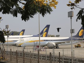 FILE- In this Monday, April 15, 2019 file photo, Jet Airways aircrafts are seen parked at Chhatrapati Shivaji Maharaj International Airport in Mumbai. Jet Airways, once India's largest airline, says it is temporarily suspending all operations after failing to raise enough money to run its services.