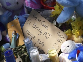 A makeshift memorial grows Monday, April 22, 2019 outside the Dole Avenue home of Andrew "AJ" Freund, age 5, in Crystal Lake, Ill. Police and the FBI continue their investigation into the missing boy.