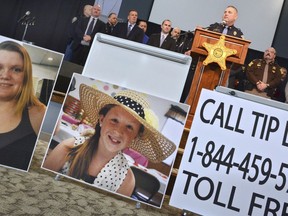 FILE - In this Feb. 22, 2017, file photo, Indiana State Police Peru post public information officer Tony Slocum provides the latest details of the investigation into the murders of teenage girls Liberty German, left, and Abigail Williams in Delphi, Ind. Indiana State Police are to make an announcement about the investigation into the 2017 killings of the two teenage girls found dead on a hiking trail. State police say Superintendent Doug Carter will discuss how the investigation has gone in a "new direction" during a Monday April 22, 2019 news conference in Delphi.