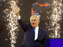 Israel's Prime Minister Benjamin Netanyahu waves to supporters after polls for Israel's general elections closed in Tel Aviv, April 10, 2019.