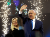 Israel’s Prime Minister Benjamin Netanyahu and Likud party leader and his wife Sara wave to his supporters after polls for Israel’s general elections closed in Tel Aviv, Israel, April 10, 2019.