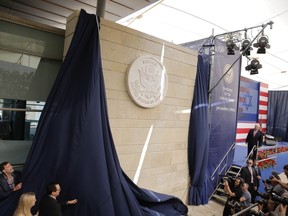 FILE - In this May 14, 2018 file photo, U.S. President Donald Trump's daughter Ivanka Trump, left, and U.S. Treasury Secretary Steve Mnuchin unveil an inauguration plaque during the opening ceremony of the new US embassy in Jerusalem. In a tight race for re-election, Netanyahu has gotten a welcome lift from his friend in the White House. Trump's recognition of Jerusalem as Israel's capital and the opening of the U.S. Embassy there, his withdrawal from the Iran nuclear deal and the decision to slash U.S. aid to the Palestinians are popular among Israelis.