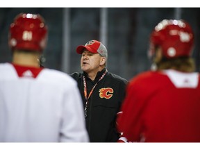Calgary Flames' head coach Bill Peters talks to players during practice in Calgary, Tuesday, April 9, 2019.THE CANADIAN PRESS/Jeff McIntosh