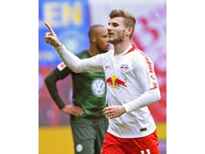 Leipzig's Timo Werner, right, celebrates after scoring his side's 2nd goal during the German Bundesliga soccer match between RB Leipzig and VfL Wolfsburg in Leipzig, Germany, Saturday, April 13, 2019.