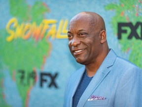 In this file photo taken on July 16, 2018, John Singleton arrives for the premiere Of FX's "Snowfall" Season 2 at Regal Cinemas L.A. LIVE Stadium in Los Angeles, California. - Johnn Singleton, director of the iconic 1991 movie "Boyz n the Hood," died Monday, April 29, 2019 at the age of 51 after suffering a stroke, his family said in a statement to U.S. media.