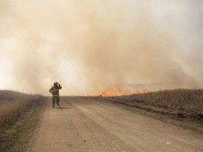 Provincial fire crews attack a brush fire near Biggar, Sask., on Tuesday, April 23, 2019.