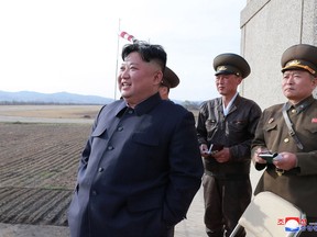 In this Tuesday, April 16, 2019, photo provided by the North Korean government, North Korean leader Kim Jong Un inspects fighter combat readiness of Unit 1017 of the Air and Anti-aircraft Force of the Korean People's Army, in an unknown location in North Korea. Kim is cautiously turning up the heat after his unsuccessful summit with U.S. President Trump in Hanoi two months ago. Returning to military optics for the first time in five months, Kim paid a surprise visit to the Air Force base and followed that up the next day by supervising the test of what the North's official media described ominously - but ambiguously, and without any photos or video - as a new type of "tactical guided weapon." Independent journalists were not given access to cover the event depicted in this image distributed by the North Korean government. The content of this image is as provided and cannot be independently verified. Korean language watermark on image as provided by source reads: "KCNA" which is the abbreviation for Korean Central News Agency. (Korean Central News Agency/Korea News Service via AP)