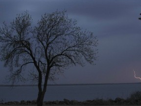 A thunderstorm moves across John Redmond Reservoir near Burlington, Kan., Wednesday, April 17, 2019. Several thunderstorms turned severe as they moved through the area.