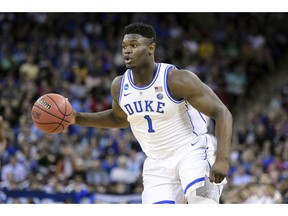 FILE - In this March 24, 2019, file photo, Duke forward Zion Williamson (1) dribbles the ball against Central Florida during the first half of a second-round game in the NCAA men's college basketball tournament in Columbia, S.C. Williamson was named the John R. Wooden Men's Player of the year at the College Basketball Awards ceremony in Los Angeles, Friday, April 12, 2019.