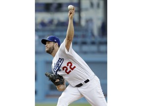 Los Angeles Dodgers starting pitcher Clayton Kershaw throws to the Pittsburgh Pirates during the first inning of a baseball game Saturday, April 27, 2019, in Los Angeles.