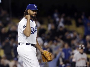 Los Angeles Dodgers relief pitcher Kenley Jansen reacts after getting San Francisco Giants' Pablo Sandoval to ground into a double play to end the baseball game, Tuesday, April 2, 2019, in Los Angeles.