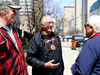 Greg Nadjiwon, chief of the Chippewas of Nawash, centre, chats outside Ontario Superior Court in Toronto on April 25, 2019. Nadjiwon and other band members were observing the start of a landmark land claim trial.