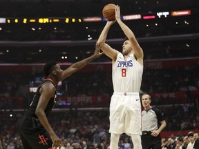 Los Angeles Clippers' Danilo Gallinari (8) shoots over Houston Rockets' Clint Capela during the first half of an NBA basketball game Wednesday, April 3, 2019, in Los Angeles.