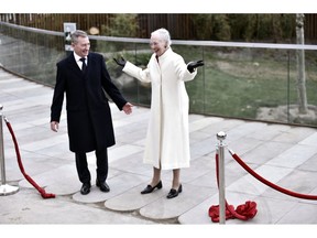 Denmark's Queen Margrethe opens the Panda House in Copenhagen Zoo, Wednesday April 10, 2019. The Queen opened a newly built, 160-million kroner ($24.2-million) enclosure at Copenhagen's zoo for two freshly arrived occupants: a pair of black-and-white bears on loan from China as the Scandinavian nation becomes part of Beijing's so-called "panda diplomacy."