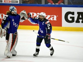 Goalie Alex Rigsby, left, and Kendall Coyne Schofield of USA celebrate a goal during the 2019 IIHF Women's World Championships preliminary match between USA and Canada in Espoo, Finland, Saturday April 6, 2019.