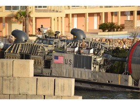 A U.S. amphibious hovercraft prepares to depart with evacuees from Janzur, west of Tripoli, Libya, Sunday, April 7, 2019. The United States says it has temporarily withdrawn some of its forces from Libya due to deteriorating security conditions. The pullout comes as a Libyan commander's forces advanced toward the capital of Tripoli and clashed with rival militias. A small contingent of American troops has been in Libya in recent years helping local forces combat Islamic State and al-Qaida militants and protecting diplomatic facilities.