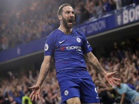 Chelsea's Gonzalo Higuain celebrates scoring his side's second goal during the English Premier League soccer match between Chelsea and Burnley at Stamford Bridge stadium in London, Monday, April 22, 2019.