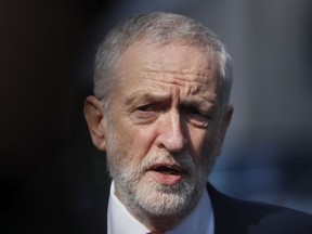 FILE - In this Thursday, March 21, 2019 file photo, British Labour Party leader Jeremy Corbyn speaks outside EU headquarters in Brussels. Corbyn, Britain's main opposition leader, says he has declined an invitation to attend a state dinner with Donald Trump during the president's visit to Britain in June. Labour Party leader Corbyn said Friday, April 26 that the government "should not be rolling out the red carpet for a state visit to honor a president who rips up vital international treaties, backs climate change denial and uses racist and misogynist rhetoric."