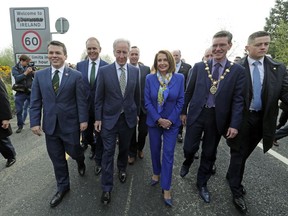 Delegates, from left, U.S. Congressman Brendan Boyle, Irish Education Minister Joe McHugh, U.S. Congressman Richard Neal and US House of Representatives speaker Nancy Pelosi, cross the Irish border from Northern Ireland into the Republic of Ireland, at Bridgened in Co Donegal, Thursday April 18, 2019.  Pelosi and other members of the U.S. delegation made the symbolic border crossing, that is the contentious Brexit border, between North and southern Ireland Thursday, as part of her four-day visit to Ireland and Northern Ireland.