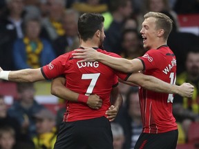 Southampton's Shane Long celebrates scoring his side's first goal of the game against Watford, during their English Premier League soccer match at Vicarage Road in Watford, London, England, Tuesday April 23, 2019.