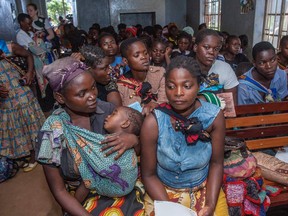 Mothers wait for their sick babies to receive treatment at the beginning of the Malaria vaccine implementation pilot programme at Mitundu Community hospital in Malawi's capital district of Lilongwe, on April 23, 2019.
