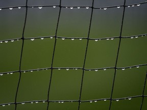 Mist collects on the netting at Fenway Park before a baseball game between the Boston Red Sox and the Tampa Bay Rays in Boston, Friday, April 26, 2019.