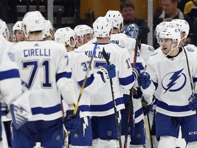Tampa Bay Lightning's Cameron Gaunce (33) celebrates with teammates after defeating the Boston Bruins in an NHL hockey game in Boston, Saturday, April 6, 2019.