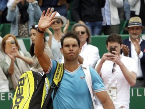 Spain's Rafael Nadal waves after losing the semifinal match of the Monte Carlo Tennis Masters tournament against Italy's Fabio Fognini in Monaco, Saturday, April, 20, 2019.