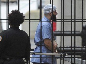 In this Feb. 3, 2016 file photo, Adnan Syed enters Courthouse East prior to a hearing in Baltimore.