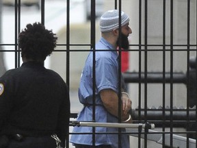 FILE - In this Feb. 3, 2016 file photo, Adnan Syed enters Courthouse East prior to a hearing in Baltimore. Maryland's highest court won't reconsider its rejection of a new trial for a man whose murder conviction was chronicled in the hit podcast "Serial" and an HBO documentary series. The defense attorney for Adnan Syed had filed a reconsideration motion with the Maryland Court of Appeals over its decision to reject a new trial. Judges on the appeals court denied that motion on Friday, April 19, 2019. Syed's defense can file a petition with the U.S. Supreme Court asking it to review the decision in Maryland.