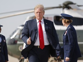 President Donald Trump gives a 'thumbs-up' as he prepares to board Air Force One, Thursday, April 18, 2019, at Andrews Air Force Base, Md. President Trump is traveling to his Mar-a-lago estate to spend the Easter weekend in Palm Beach, Fla.