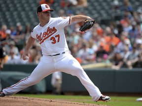 Baltimore Orioles starting pitcher Dylan Bundy delivers a pitch in the first inning of a baseball game against the Minnesota Twins, Sunday, April 21, 2019, in Baltimore.