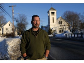 In this Tuesday, March 12, 2019 photo, former SWAT officer Al Joyce walks in Norway, Maine. Joyce left his job in law enforcement in Jefferson County, Colorado, after a school shooting and now works as a cashier. Joyce was part of the team that in 2006 stormed a classroom in Platte Canyon High School in the town of Bailey, southwest of Denver and saw the aftermath of a shooting. It wasn't long before the nightmares began and he started drinking heavily to avoid them. He ended up leaving the SWAT team, divorcing his wife and withdrawing from the world. "I wanted to just shut down, turn off," he said. "It didn't work out so well."