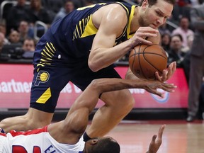 Indiana Pacers forward Bojan Bogdanovic steals the ball away from Detroit Pistons guard Wayne Ellington (20) during the first half of an NBA basketball game, Wednesday, April 3, 2019, in Detroit.