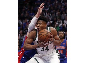 Milwaukee Bucks forward Giannis Antetokounmpo (34) is defended by Detroit Pistons forward Blake Griffin during the first half of Game 3 of a first-round NBA basketball playoff series, Saturday, April 20, 2019, in Detroit.