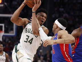 Milwaukee Bucks forward Giannis Antetokounmpo (34) is fouled by Detroit Pistons guard Bruce Brown (6) during the first half of Game 4 of a first-round NBA basketball playoff series, Monday, April 22, 2019, in Detroit.