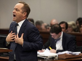 FILE - In this Feb. 6, 2019 file photo, Special prosecutor Todd Flood, left, speaks during a motion hearing at Genesee County Circuit Court in Flint, Mich. Flood, a special prosecutor who spent three years leading a criminal investigation of the Flint water scandal has been fired, officials announced Monday, April 29, 2019, apparently part of the fallout from the recent discovery of 23 boxes of records in the basement of a state building.